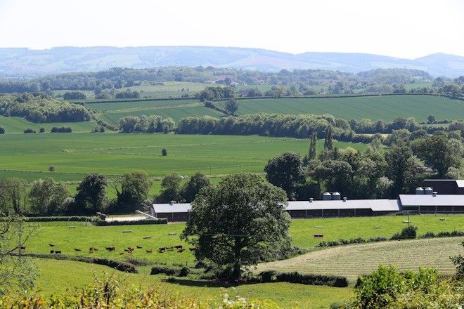View of a farm set in a green lush valley