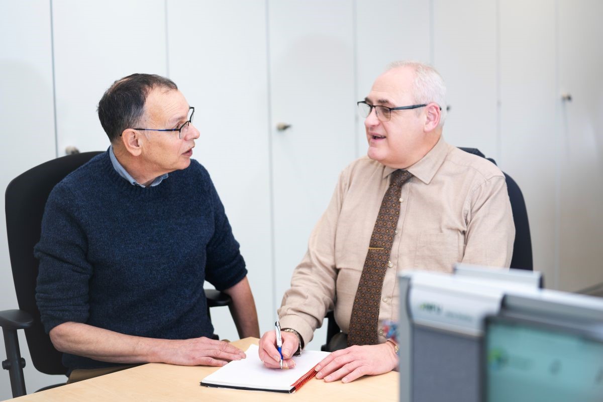 Managers sat talking in an office