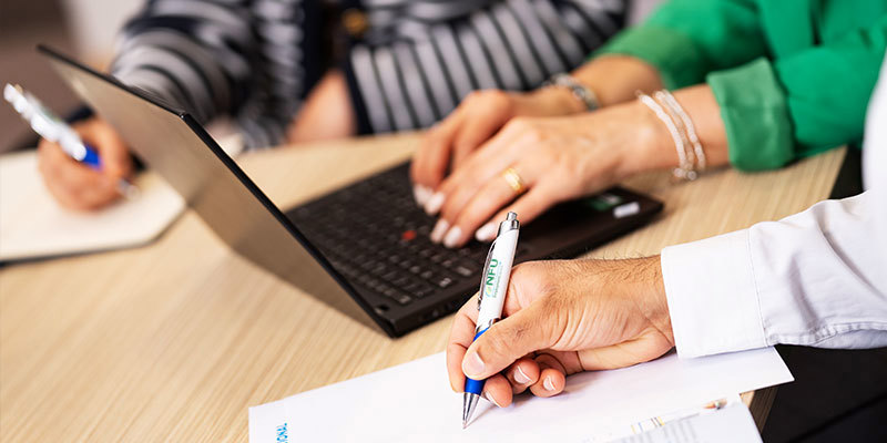 Three People Laptop Writing Diary